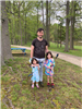 Dad and His Two Daughters Attending the Park Clean-up