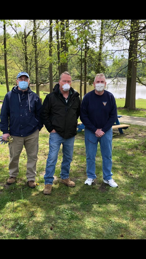 Three Older Men Attending the Park Clean-up Event