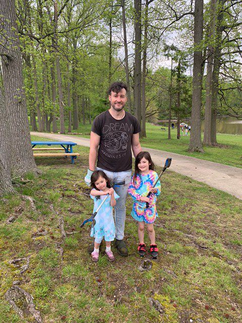 Dad and His Two Daughters Attending the Park Clean-up