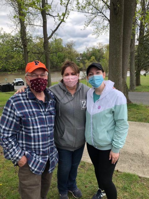 Three Volunteers Take a Group Photo
